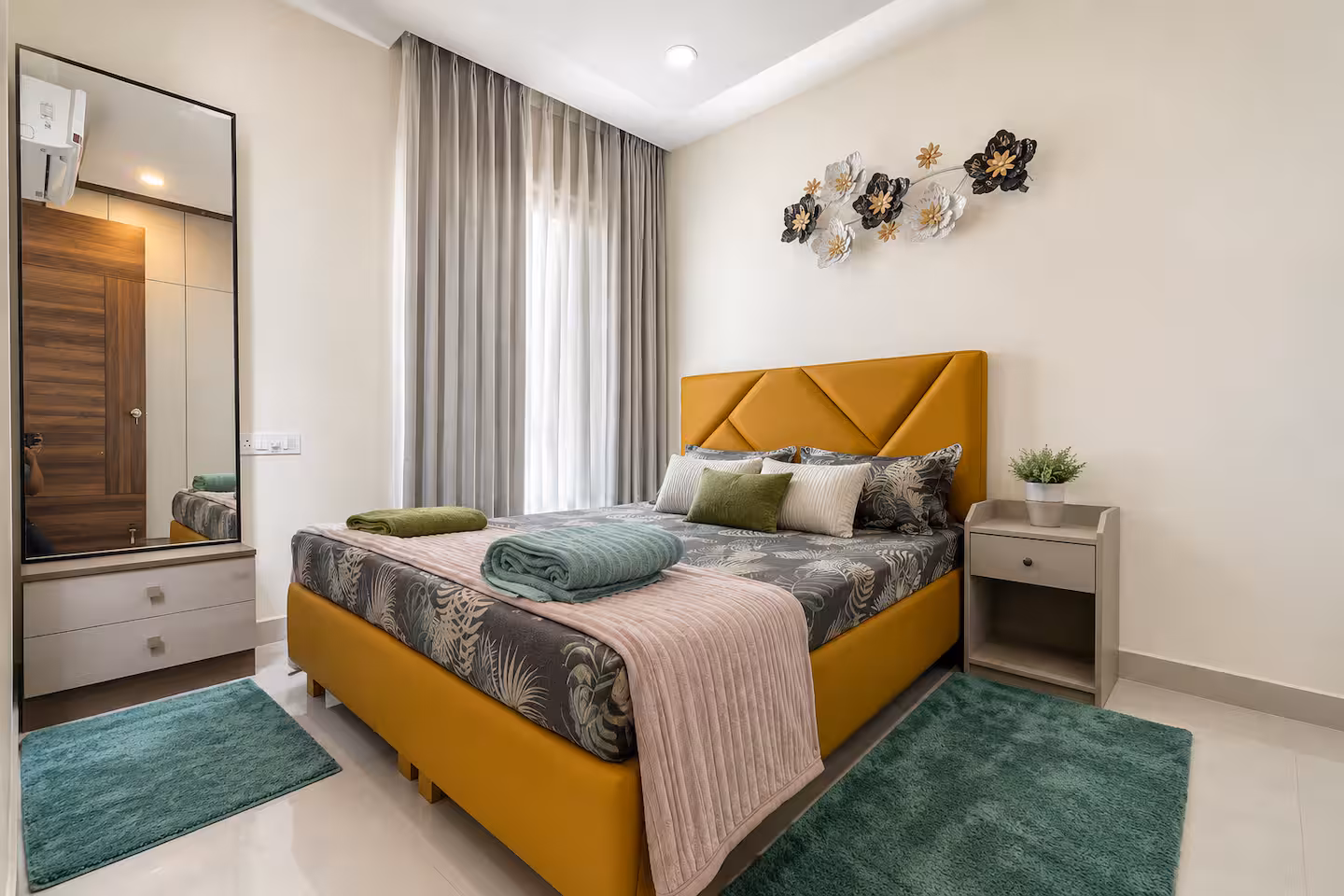 A well-kept bedroom in a residential property Lands & Riches manages
