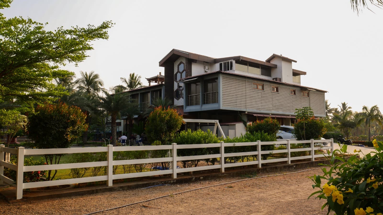 Farmhouse exterior and driveway, built by Lands & Riches